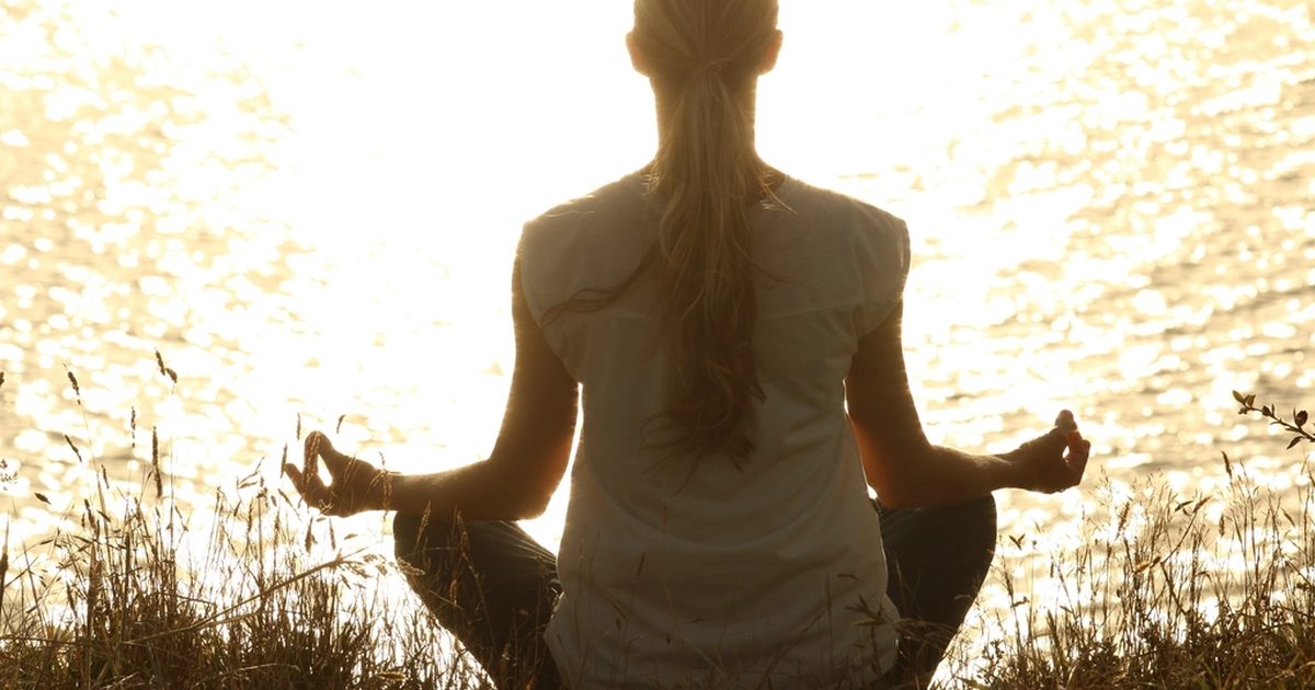 A woman practicing a calm yoga pose