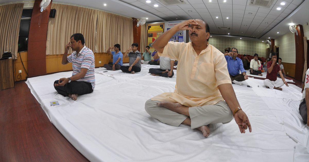 People practicing alternate nostril breathing on International Day of Yoga in Kolkata